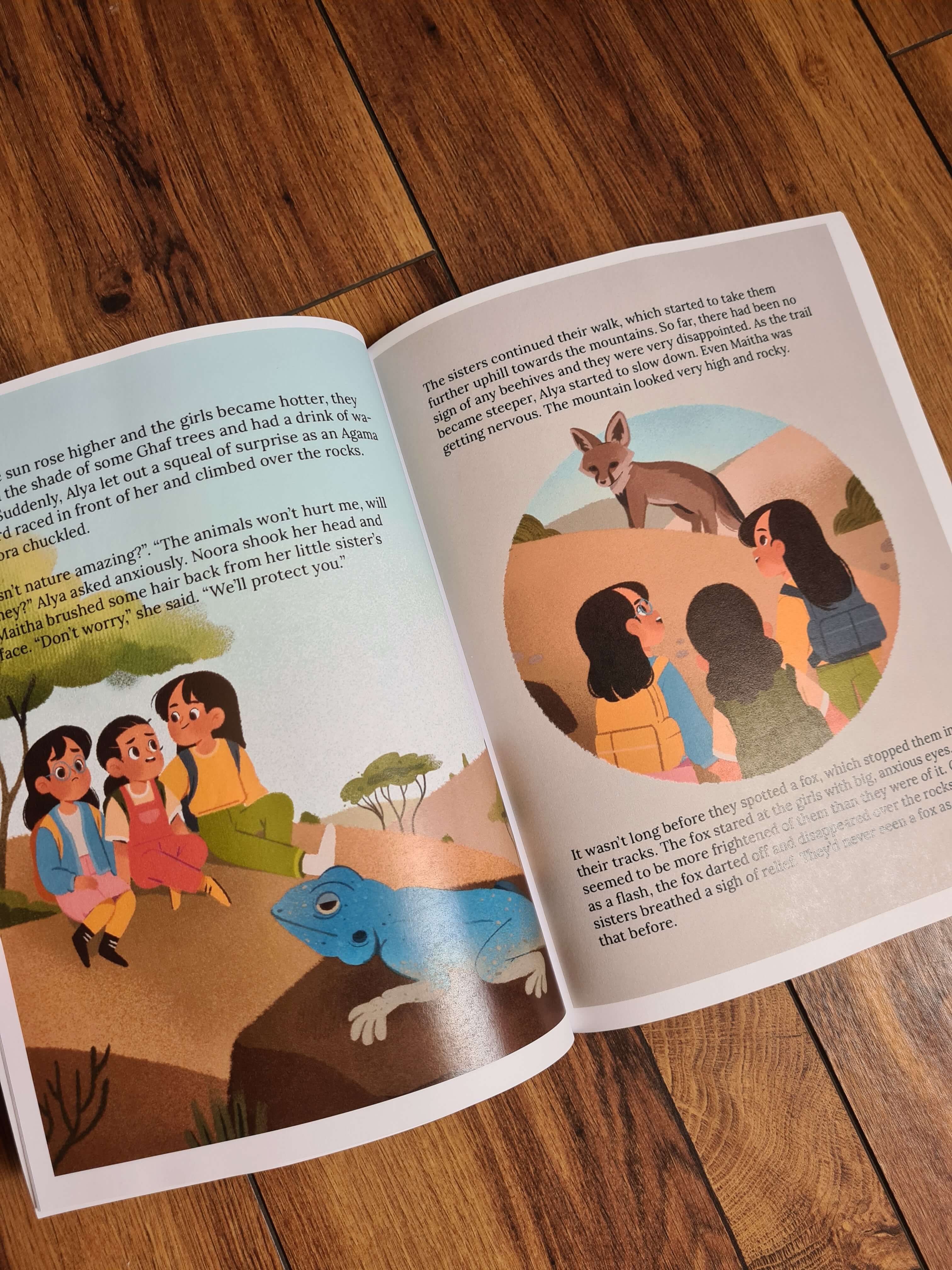 inside pages on mountain girls book showing characters and wildlife like blue lizard and arabian fox